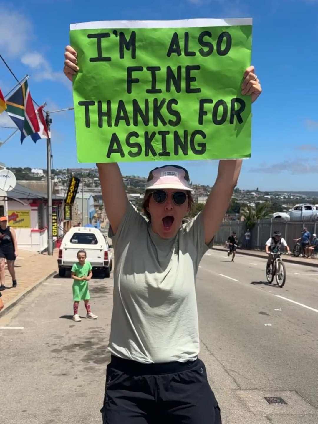 Motivational running sign that says, "I'm fine thanks for asking"