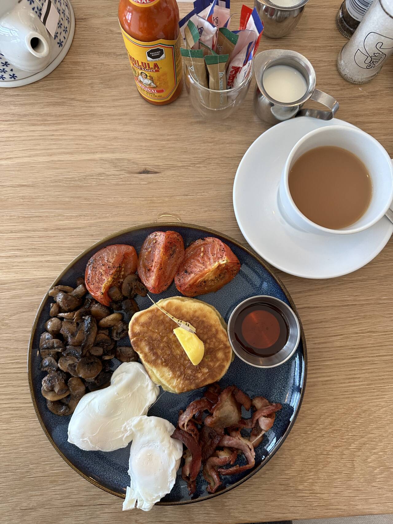 Butter Breakfast with eggs, tomato, mushrooms and a flapjack